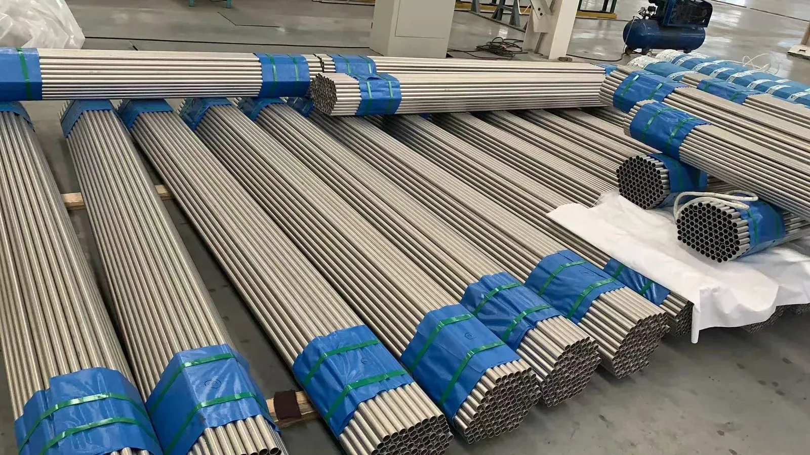 Bundles of titanium tubing staged at a qualified manufacturing partner facility.